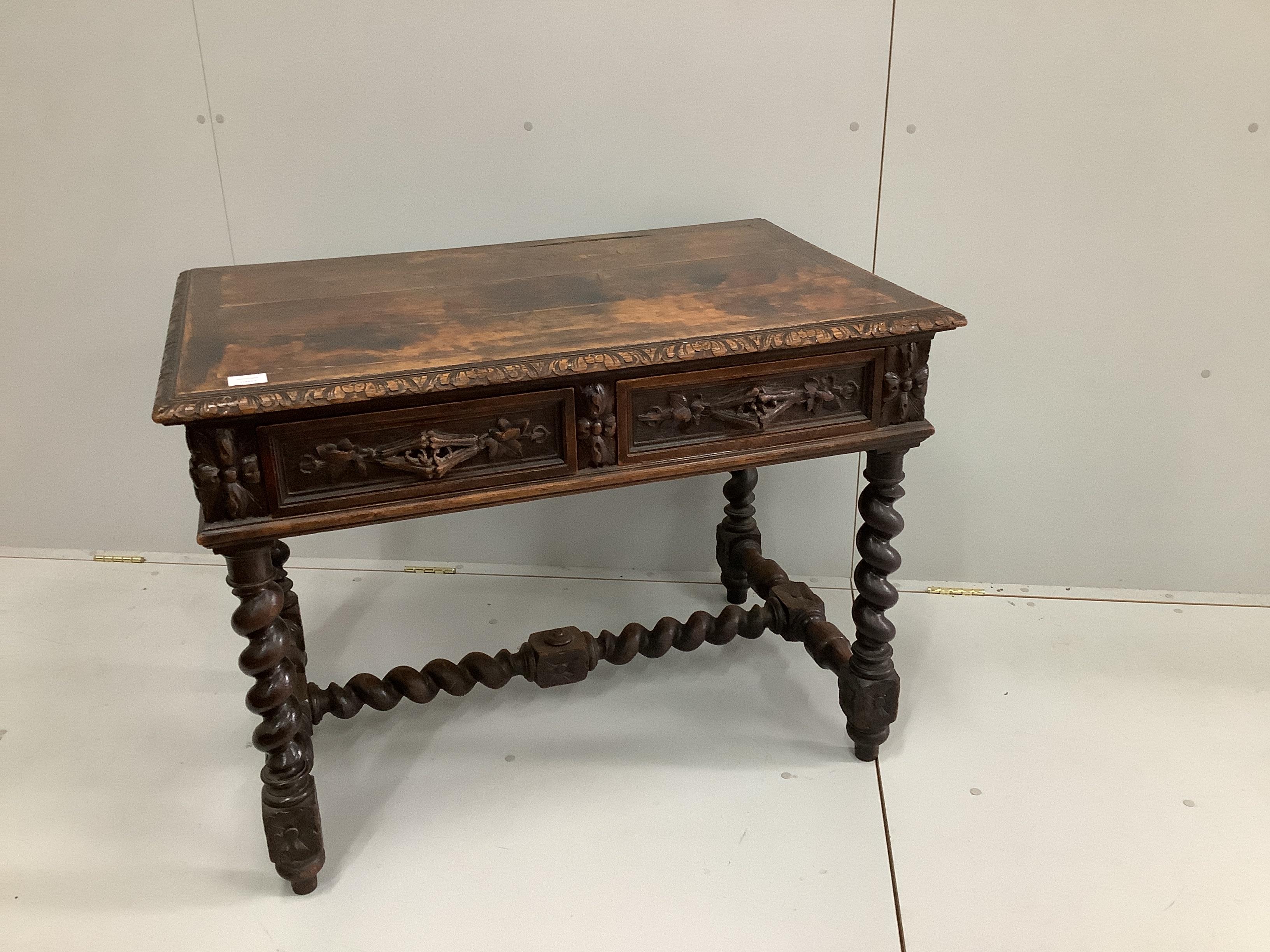 A late 19th century Flemish carved oak two drawer side table, with a barley twist under frame, width 99cm, depth 64cm, height 75cm